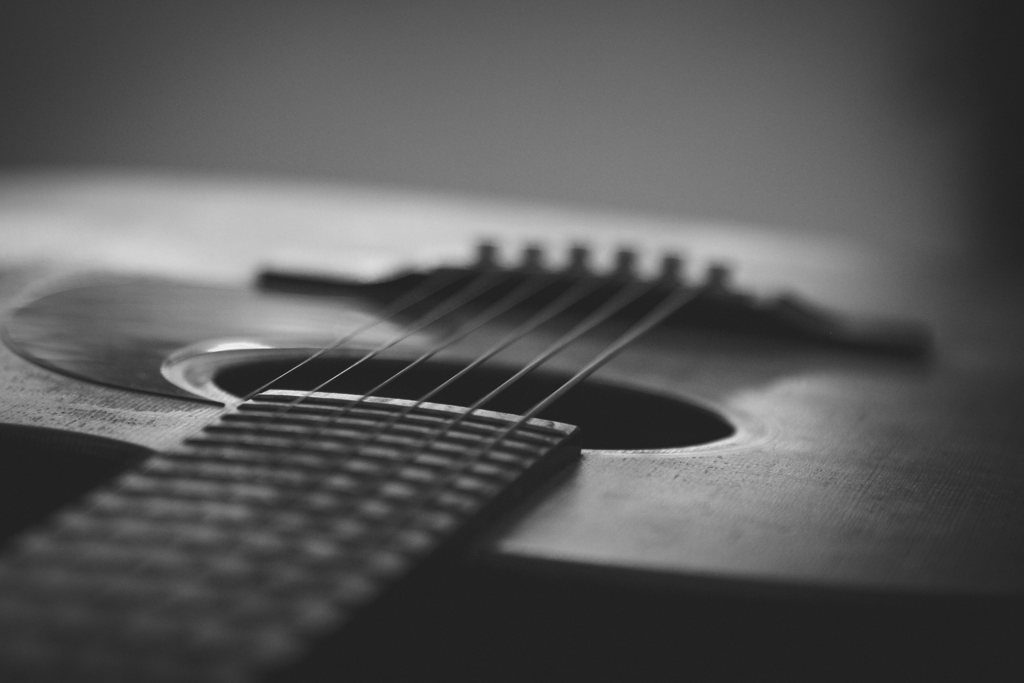 Grayscale Photo of an Acoustic Guitar